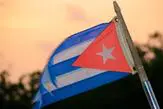 c9adbd872d5481f348deab8afa4434bc Cuban flag waving against an orange sunset sky.
